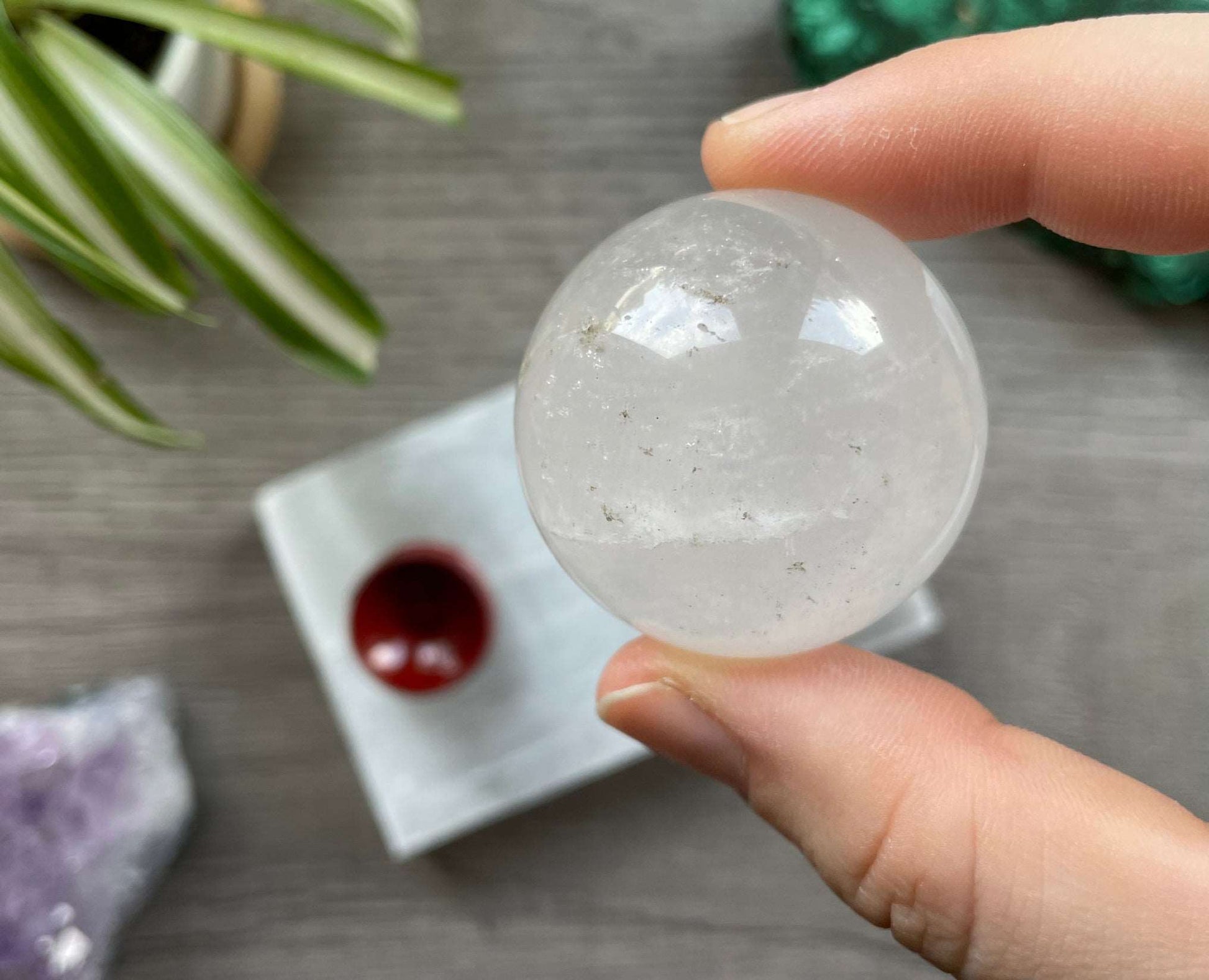 Pictured is a sphere carved out of clear quartz. Clear Quartz Mini Crystal Sphere 38mm (B) 