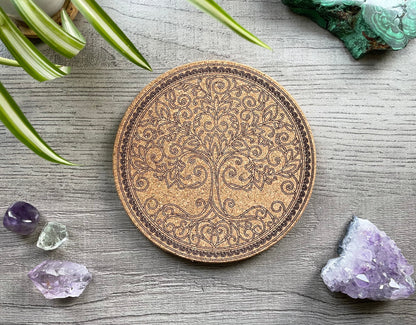 Pictured is a cork trivet with a tree of life design on it. Tree of Life Cork Trivet (Small) front