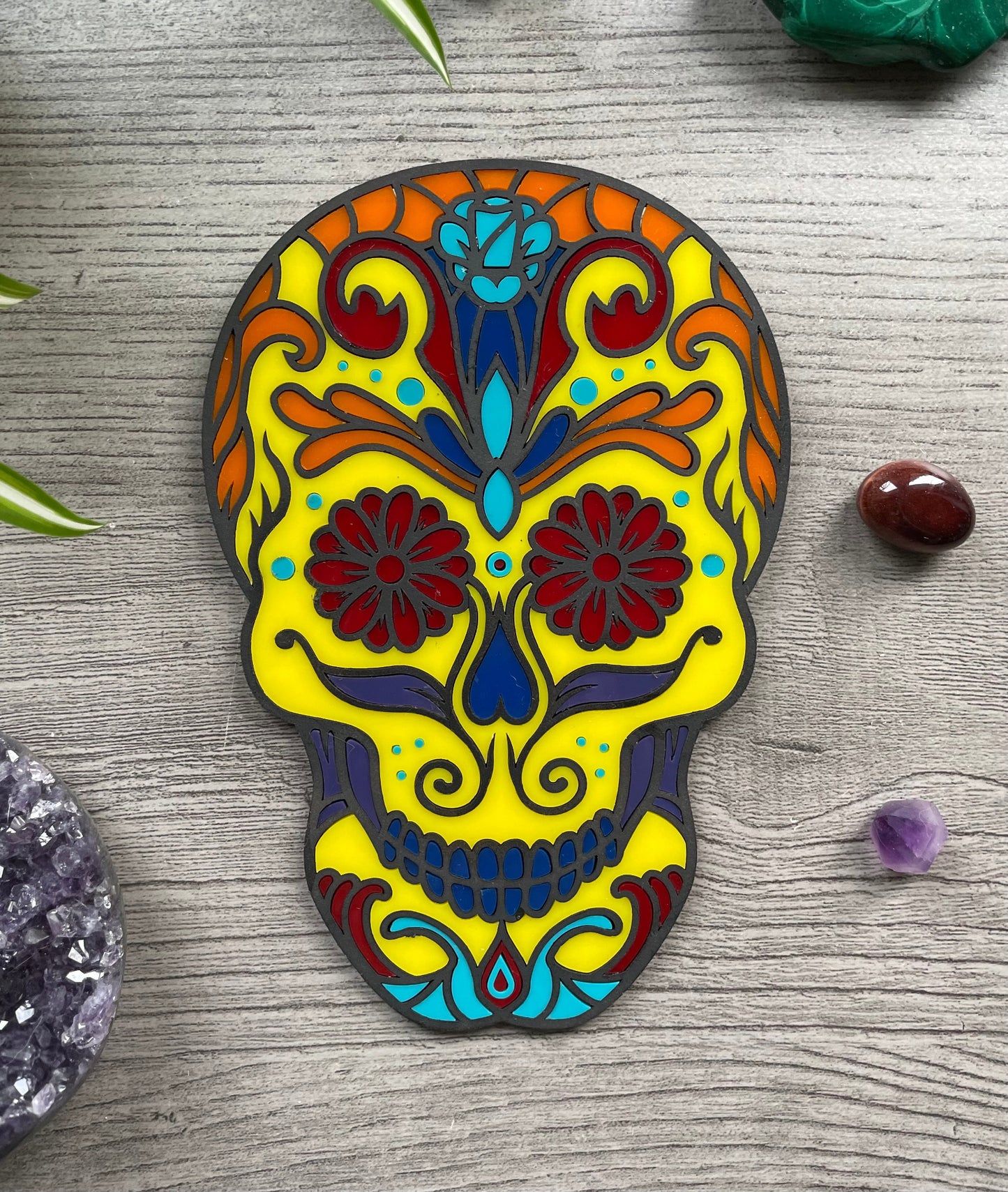 Pictured is a faux stained glass sugar skull made out of wood and acrylic. Sugar Skull Wall Art (Yellow) front 